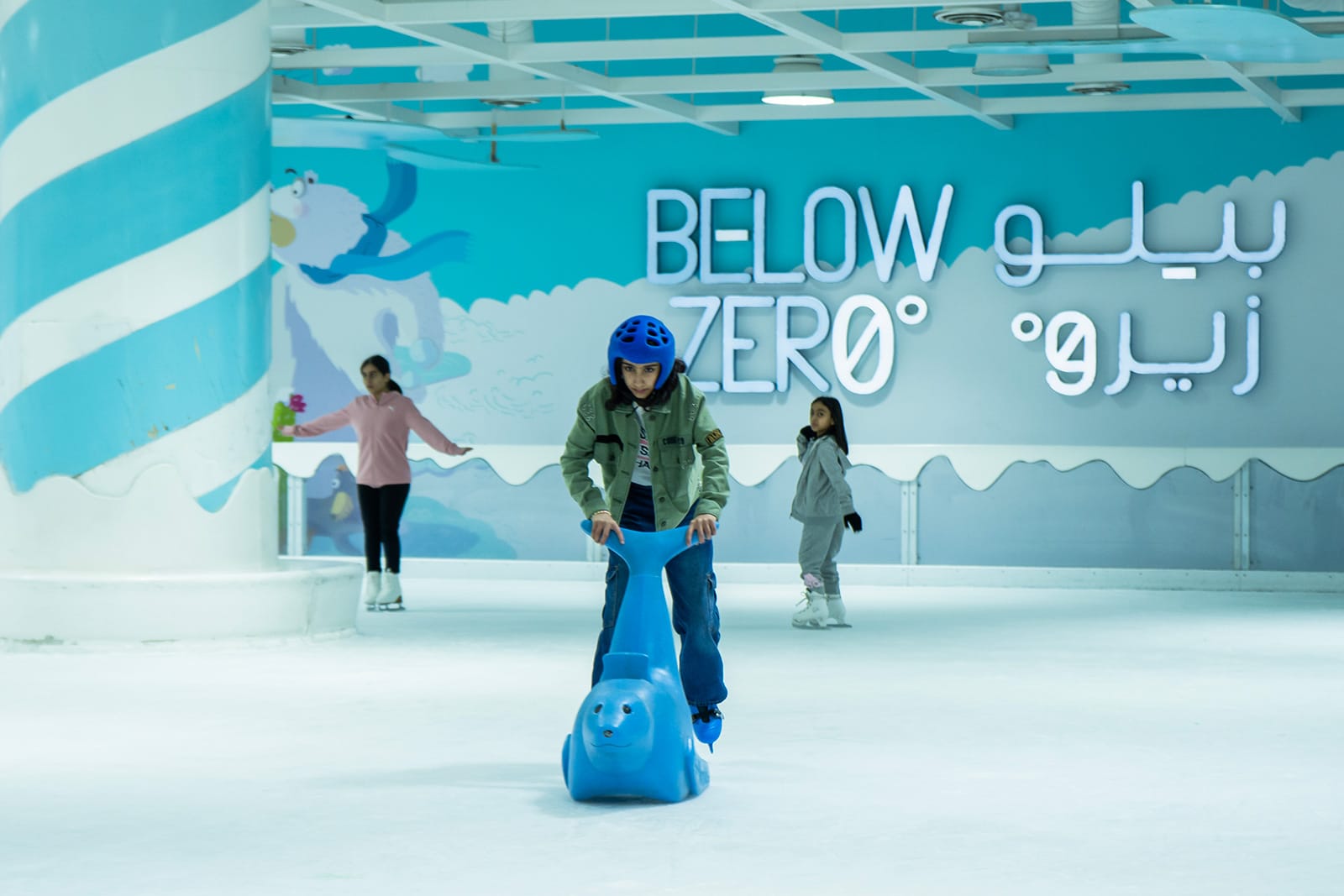 Below zero ice rink, some skaters on the ice