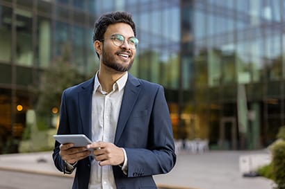 Smiling man with electronic tablet.